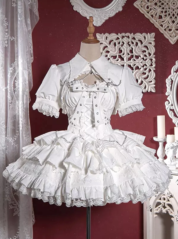 White gothic lolita dress and bolero set with corset bodice lace ruffled trims and chain decorations displayed on dress form