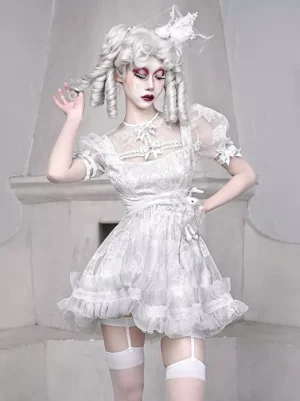 White Gothic Lolita Dress with Lace and Bows - Three Quarter Front View on Model with Gothic Styling and Fireplace Background