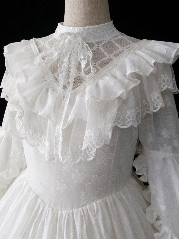 White Gothic Lolita dress upper details close-up lace ruffle collar mesh yoke bow tie decoration neckline embellishment
