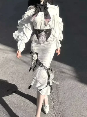 White Gothic Lolita dress set full-body front view featuring puff long sleeves, black bow tie detail, ruffled mermaid skirt with ribbon trims, and black cummerbund waistband