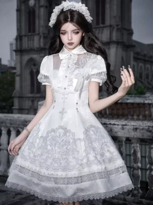 White Gothic Lolita dress three-quarter front angle featuring sheer collar panel cross tassel decoration and fitted waist with lace skirt overlay detail