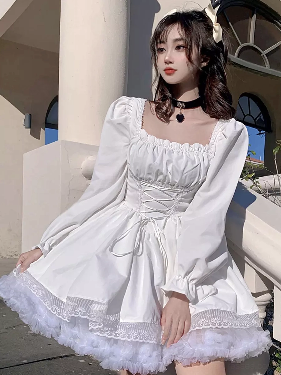 White gothic lolita lace-up corset dress full front body view with puff sleeves, fluffy tulle ruffle hem - outdoor arch balcony background