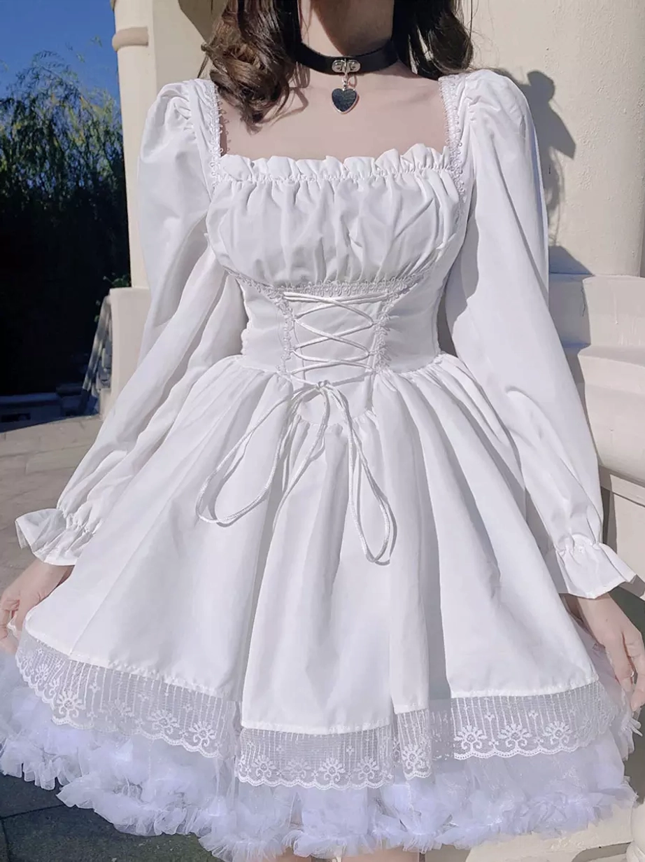 White gothic lolita dress close-up half-body view, lace-up corset waist, puff sleeves, lace tulle hem detail - outdoor building setting