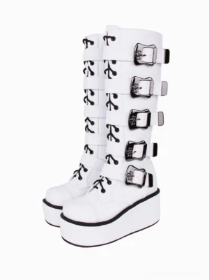 White gothic lolita platform boots front three-quarter view showing pristine white pu leather, black lace-up accents, multiple silver buckles, round toe, thick black-trimmed platform sole