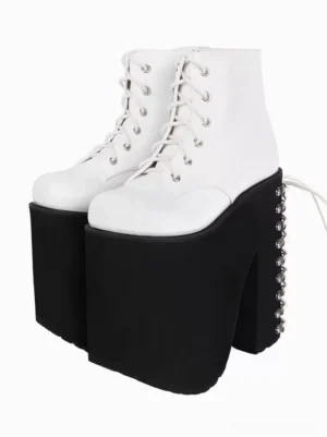 white gothic lolita platform ankle boots with silver metallic grommets front oblique view