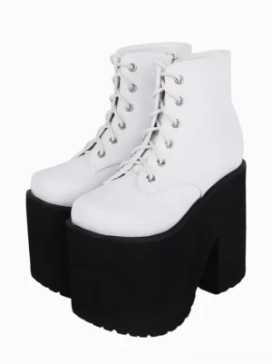 White gothic lolita platform ankle boots with silver grommets front three-quarter view showing round toe and crisscross lacing detail