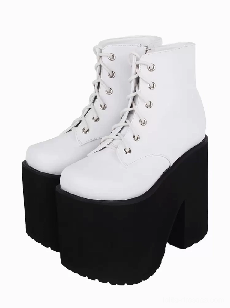 White gothic lolita platform ankle boots with silver grommets front three-quarter view showing round toe and crisscross lacing detail