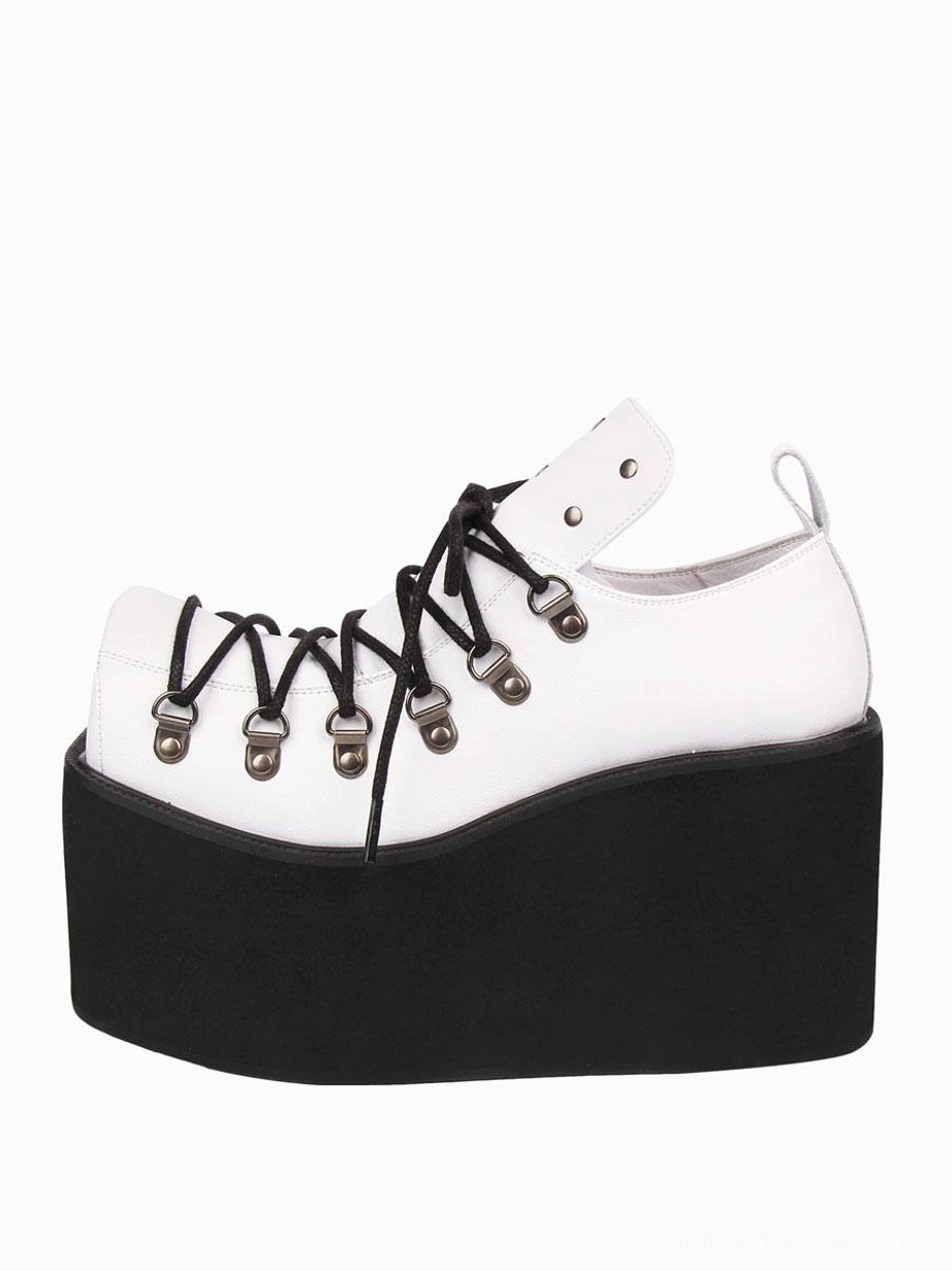 Single white gothic platform pump with heel pull tab, high wedge platform sole, side three-quarter angle showing matte white PU leather construction