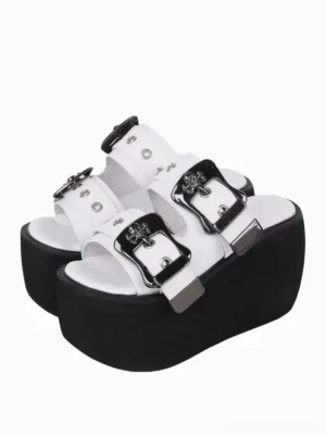 Paired white gothic lolita platform sandals with silver skull buckles front three-quarter view peep toe design metallic pu leather thick black wedge sole