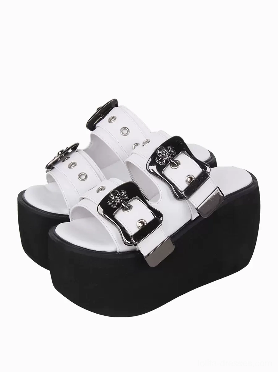 Paired white gothic lolita platform sandals with silver skull buckles front three-quarter view peep toe design metallic pu leather thick black wedge sole