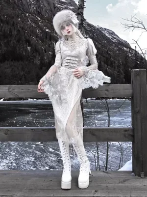 Gothic Lolita white qipao gown side three-quarter view with high slit platform boots and sheer mesh panel on lakeside