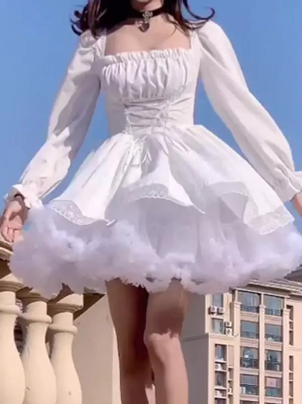 White gothic lolita mini dress full front view, square neckline, fluffy ruffle tulle hem - outdoor balcony blue sky backdrop