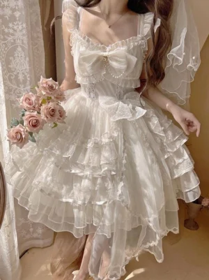 White hime lolita JSK fairy wedding dress front full-body view with voluminous tulle skirt, chest bow and high-low hem