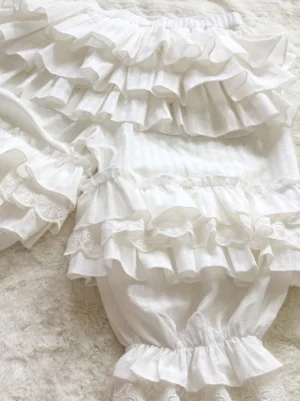white jacquard lolita bloomers with multi-layer tiered ruffles close-up overhead view showing detailed ruffle construction and elastic waistband