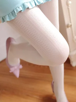 white jacquard silk lolita tights close-up texture shot of legs wearing elegant pantyhose with subtle woven pattern on wooden floor