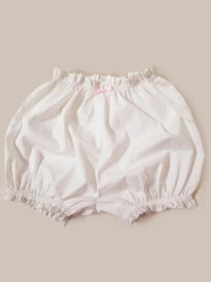 Classic white lace bloomers with ruffled elastic waist and delicate pink bow detail, flat lay front view showing full design and pleated construction