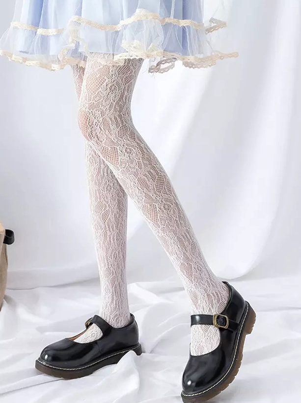 White embroidered botanical fishnet lace stockings side leg view with blue ruffled coordinate and Mary Jane footwear