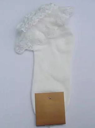 Single white lace ruffle ankle sock with layered delicate cuff detail, close-up flat lay on light gray background showing sock construction and texture