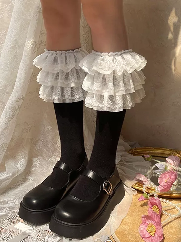 White lace ruffle lolita calf socks paired with black platform Mary Jane shoes front close-up view sweet lolita coordinate