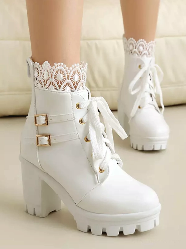 White Lolita ankle boots close-up oblique front view showing chunky block heel decorative buckles and round toe design
