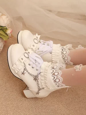 White Lolita ankle boots side oblique angle showing lace trims, star chain details, and lace-up design on indoor carpet background