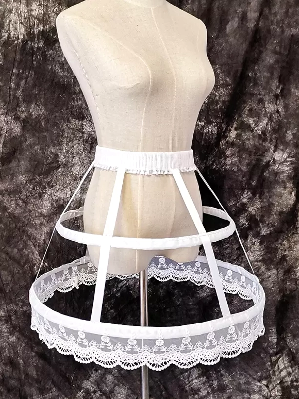 White Lolita birdcage petticoat left three-quarter view showing side profile silhouette and floral scalloped lace hem detail