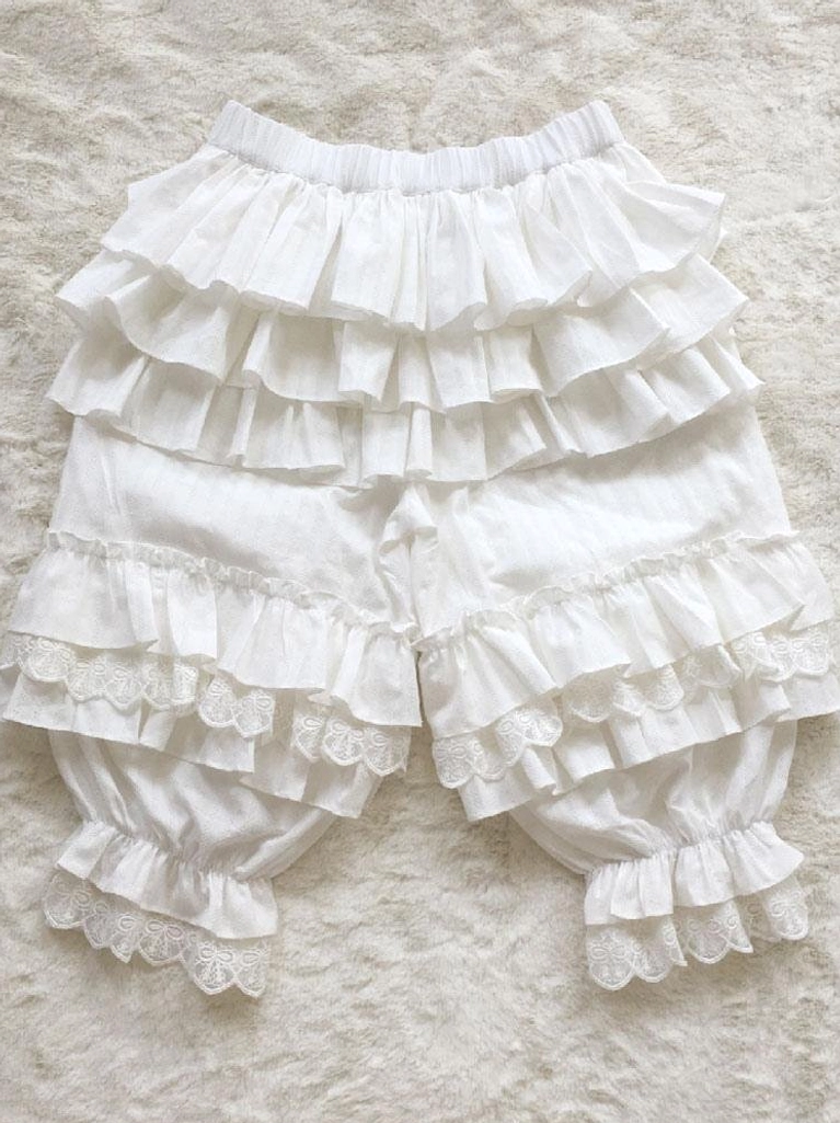 white lolita bloomers full flat lay overhead view featuring lace-trimmed leg cuffs and elasticated waist perfect for sweet lolita fashion