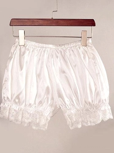 White lolita bloomers hanging on wooden clothes hanger, front view showing full gathered silhouette, elastic waist design, and delicate white lace hem ruffles