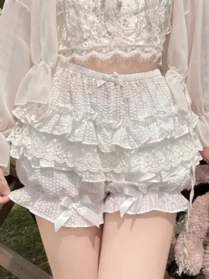 White layered lace lolita bloomers with satin leg bows front view outdoor lawn setting sweet lolita coordinate