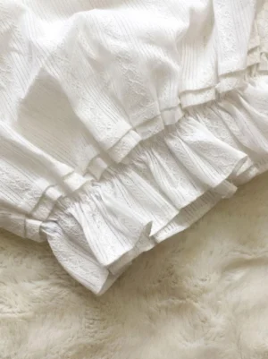 close-up detail of lolita bloomers hem layered ruffles vertical stripe jacquard pleated trims