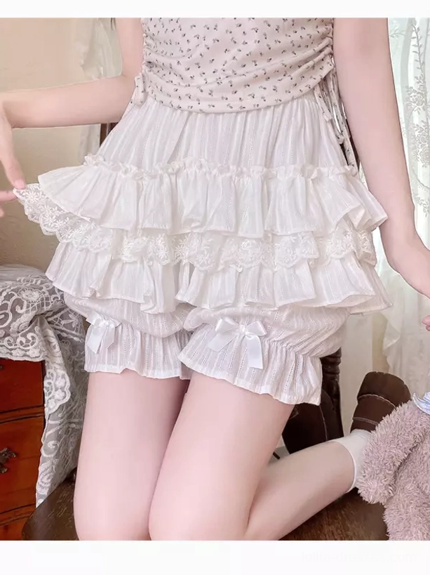White lolita bloomers safety shorts side close-up with elastic waist layered ruffled trim bow on cuffs pumpkin pants shape