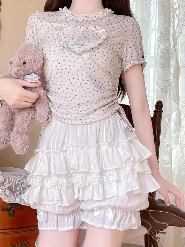 White lolita bloomers front full lower body view tiered ruffle design classic silhouette on model holding teddy bear