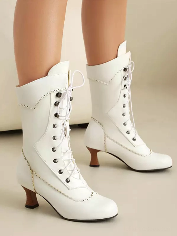 White vintage lolita boots with brogue-style decorative stitching metal lace hardware low kitten heel front paired view