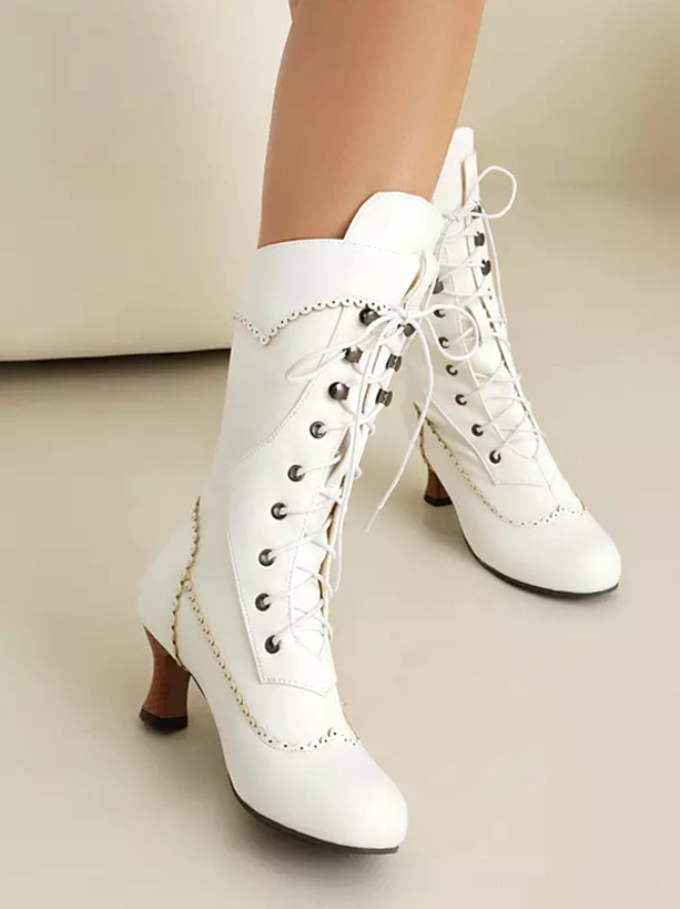 White vintage lolita boots with contrast stitched edges brown tapered heel and round closed toe front side view
