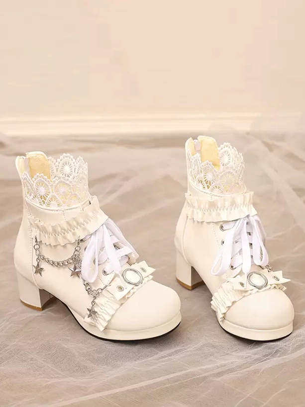 White Rococo Lolita boots flat lay oblique perspective featuring crown lace collar, star chain embellishment, block heel, and puppy heel silhouette