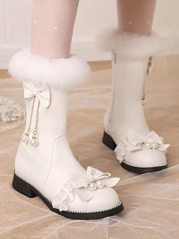 White lolita mid-calf boots with white faux fur collar, pearl tassel bow detail, white ruffle front design, modeled with nude stockings, dual side view