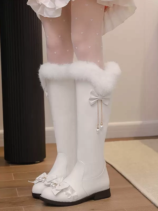 White lolita boots front view worn indoors showing dual bow vamp decor pearl pendants clean leather