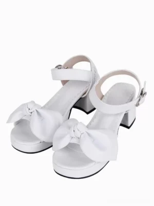 White lolita platform heel sandals with knotted front bow, chunky block heel, and thick platform sole, shown from front flat view on white background