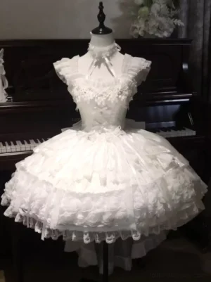 White lolita bridal dress displayed on dress form with halter neck design and lace-trimmed flared satin skirt vintage piano background