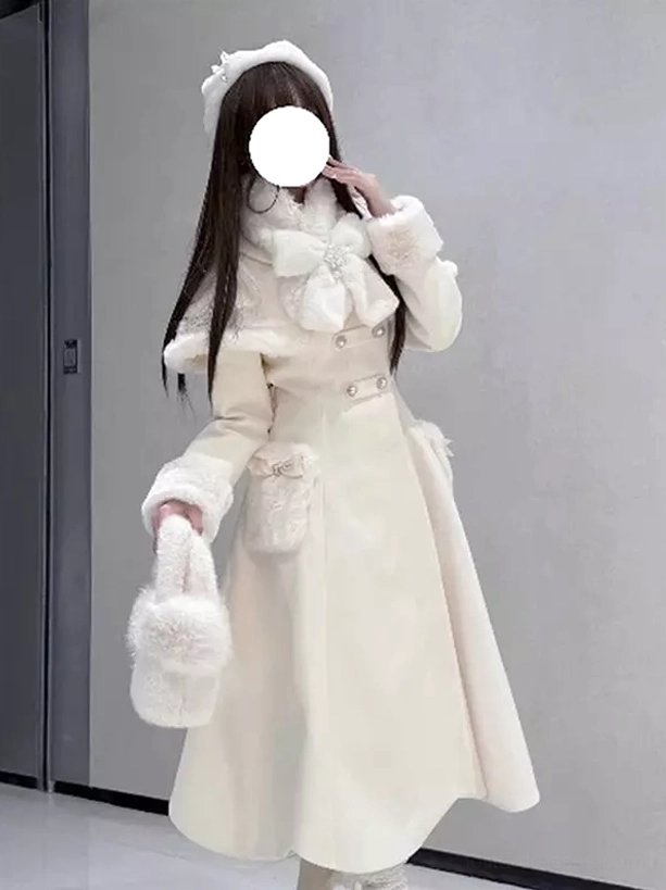 Front three-quarter view white lolita double-breasted cape coat with fur-trimmed cuffs, model wearing white beret and holding fuzzy handbag