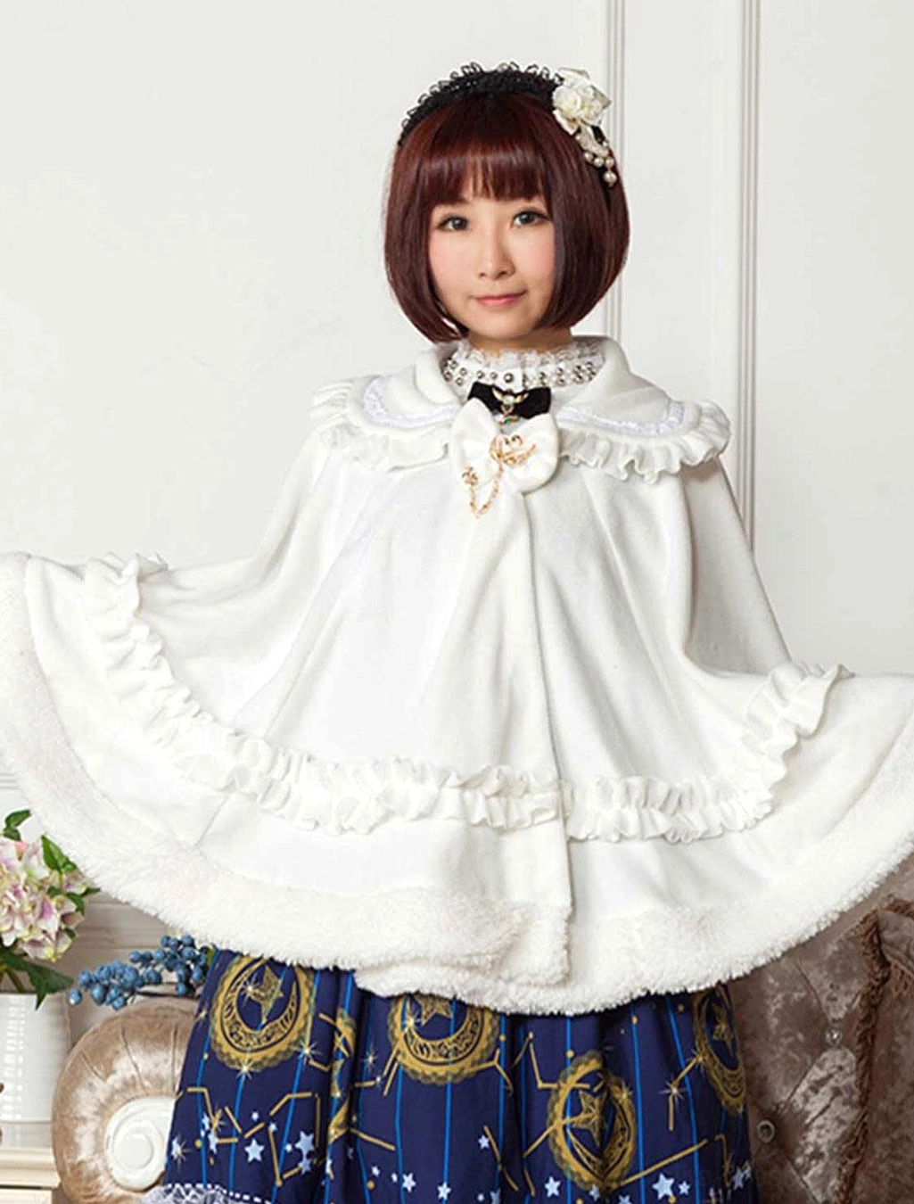 sweet lolita white cape cloak with ruffled peter pan collar front medium shot floral background