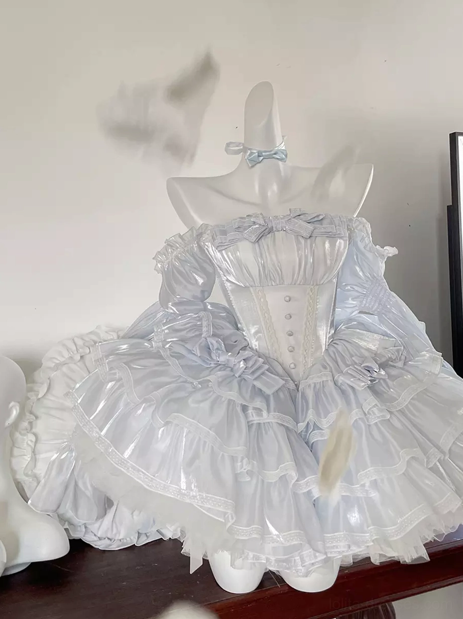 White fairy lolita dress front flat view with button-front corset bodice, tiered ruffle skirt, shiny sheer fabric layers, and coordinating blue bow choker