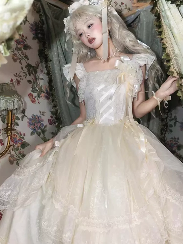 Classic Lolita white fairy wedding dress with ruffled square neckline and voluminous tulle skirt, front medium shot with floral hair veil against floral curtain background
