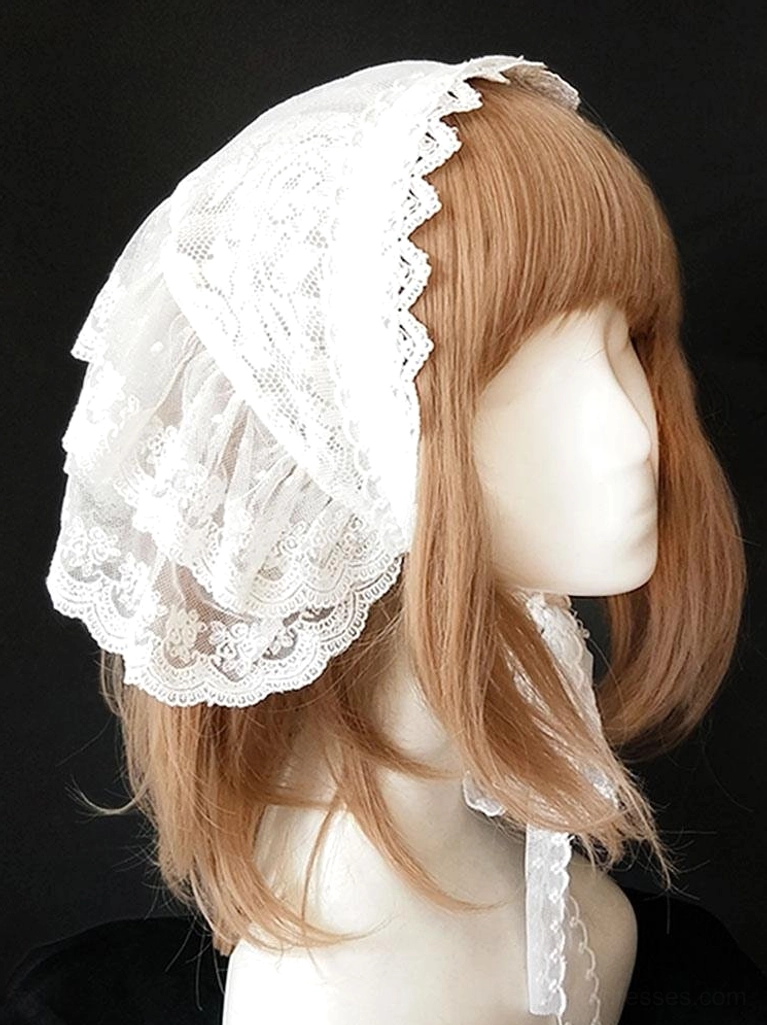 Left side profile of white scalloped lace lolita headwear showing dimensional layered lace construction