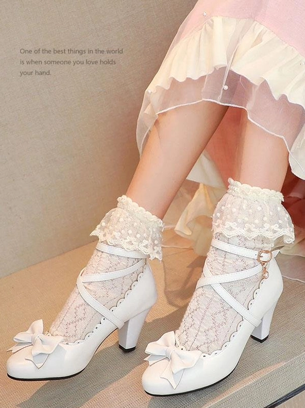 White lolita high heel shoes side profile showing block prism heel and ankle buckle strap worn with pink ruffled lolita dress
