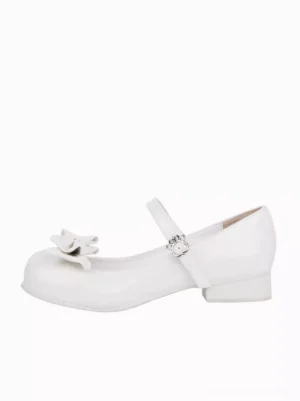 Single white Lolita pump Mary Jane shoe left side three-quarter view, displaying front bow embellishment, low block wedge heel, and mary jane strap with paw buckle