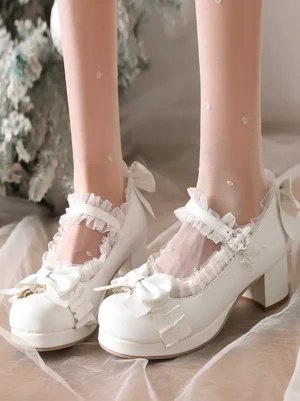 White Lolita Mary Jane pumps with dual front bows and ruffled ankle straps, worn with polka dot sheer stockings, top-down front on-foot view showcasing round toe design