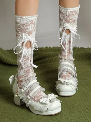 White lolita Mary Jane platform pumps front view with cross straps bow decoration pearl details worn with tie-up lace mid-calf socks