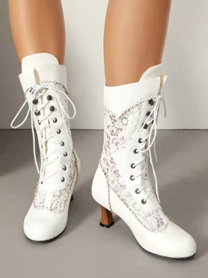 white lolita boots angled frontal view showing decorative stitching metal lace eyelets round toe design