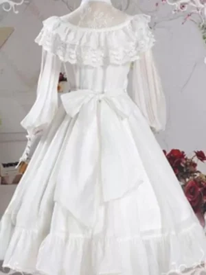 White Lolita one-piece dress back view showing large decorative bow and layered ruffled skirt hem with lace yoke detail